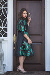 Black modest cocktail dress with green beaded flowers and pop over cropped jacket 